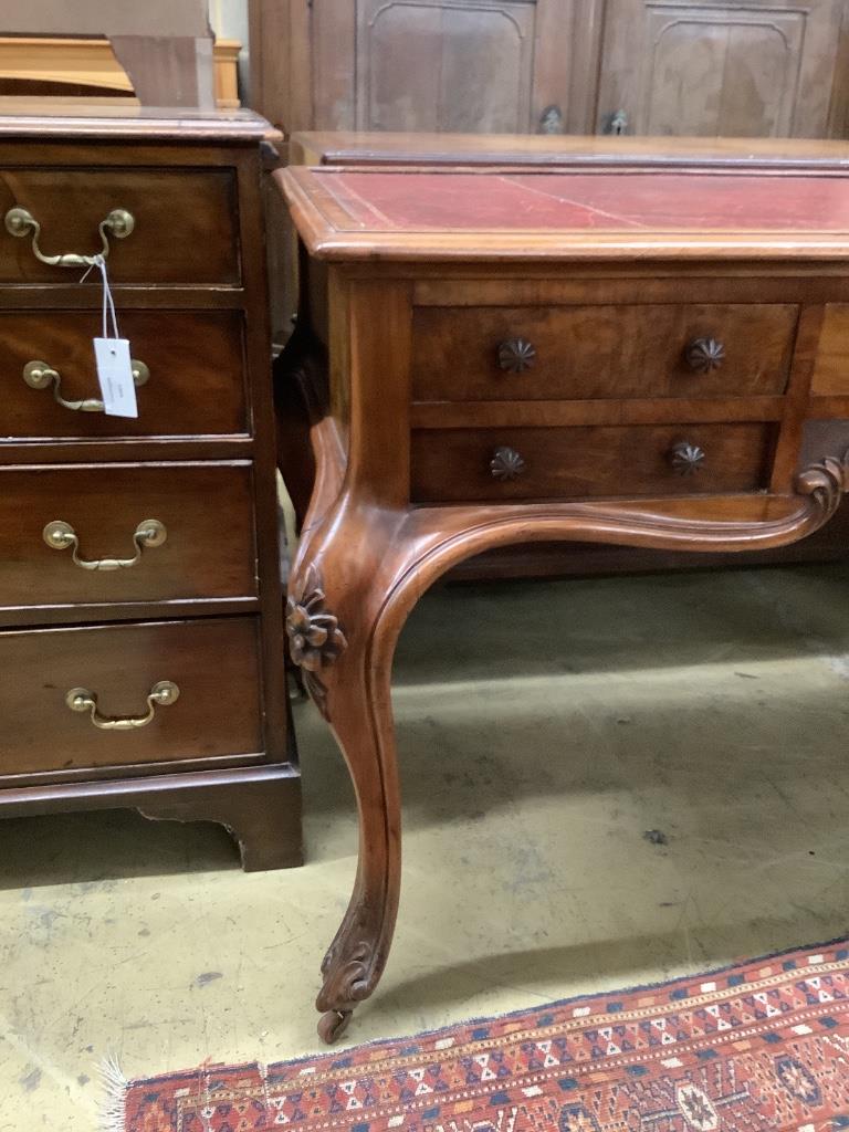 A Victorian walnut kneehole rosewood desk by Wilkinson & Son, Old Bond Street, stamped 11761, width 134cm, depth 64cm, height 75cm